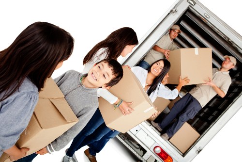 Professional movers loading a van for a Hampton Wick relocation