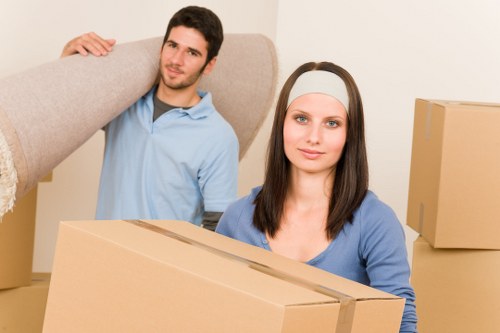 Professional movers loading furniture for a local house relocation